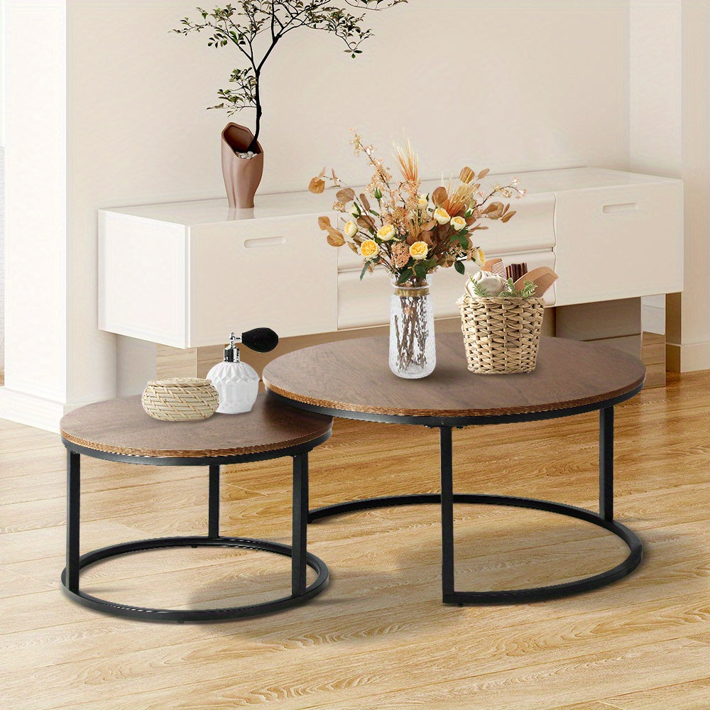 Nutshell 2pcs Round Nesting Coffee Table Set with wooden tops and black metal frames in modern living room
