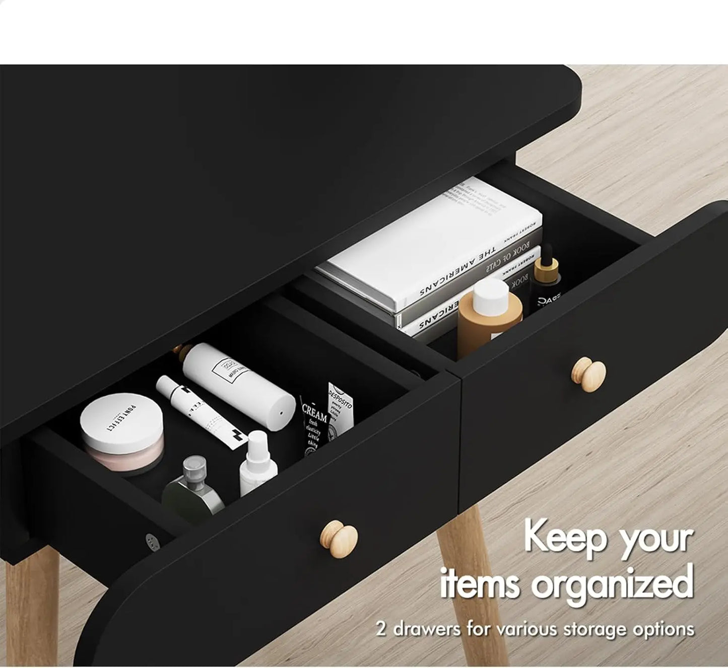 Black Nutshell dressing table and stool set with two open drawers showing organized cosmetics and wooden knobs