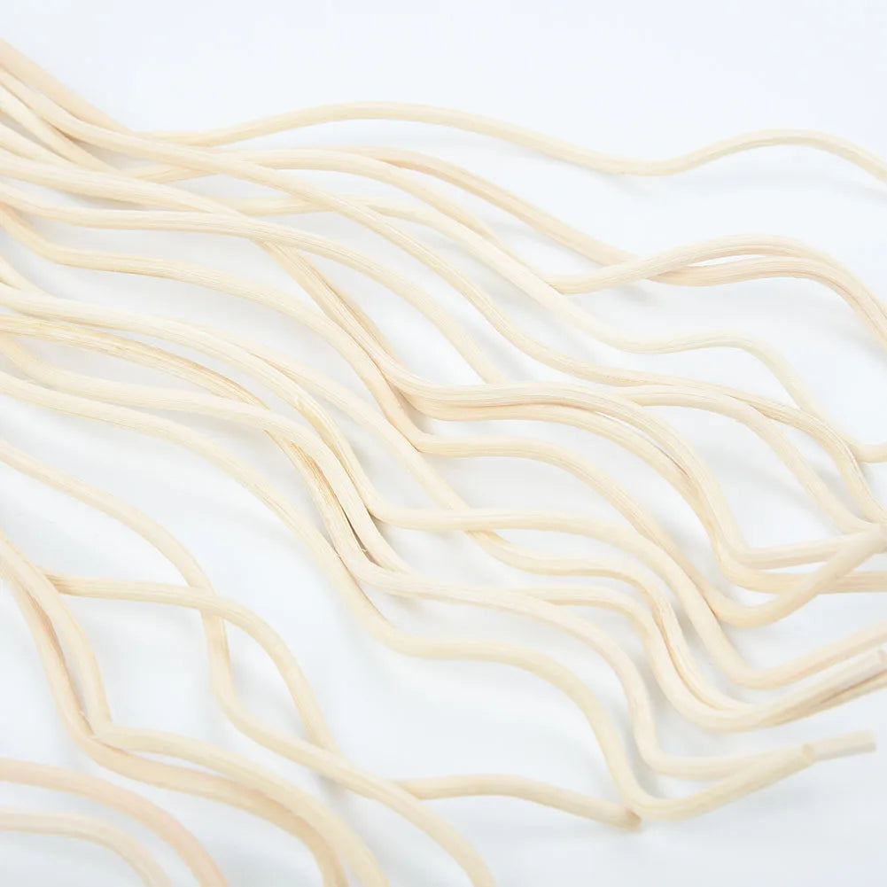 Nutshell aromatherapy wavy reed diffuser sticks in natural wood finish on white background