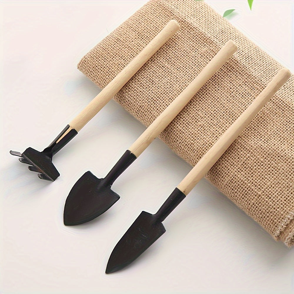 Nutshell Black 3 Tier Wooden Pot Plant Stand Storage Rack displaying tools and a natural fiber backdrop