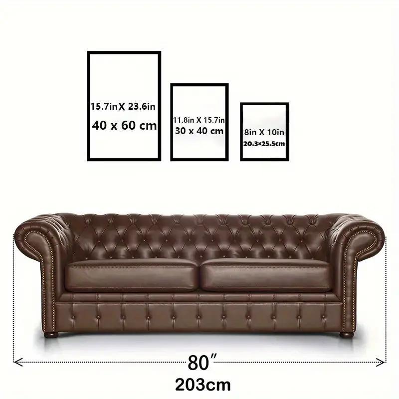 Elegant black and white abstract wall art displayed above a stylish brown leather sofa for modern décor