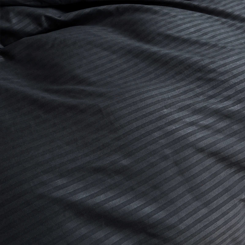 Nutshell black satin duvet cover set with subtle striped pattern and smooth luxurious texture