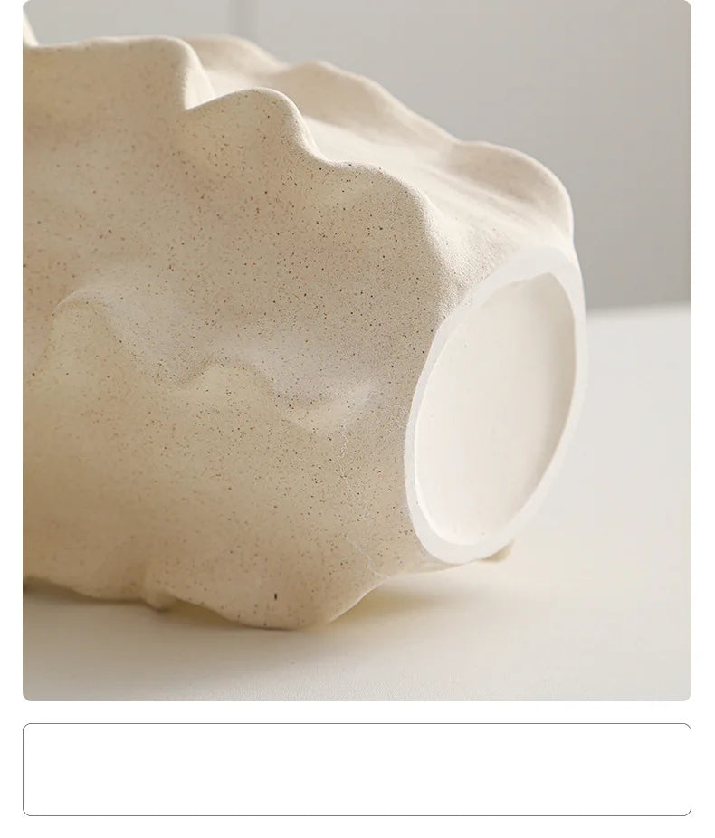 Nutshell ceramic conch design vase in natural beige textured finish close-up view