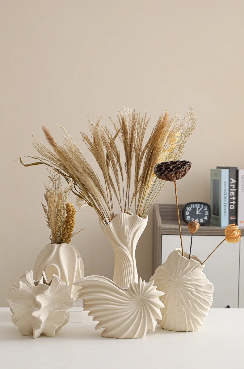Nutshell ceramic conch design vase set in neutral beige with dried floral arrangements
