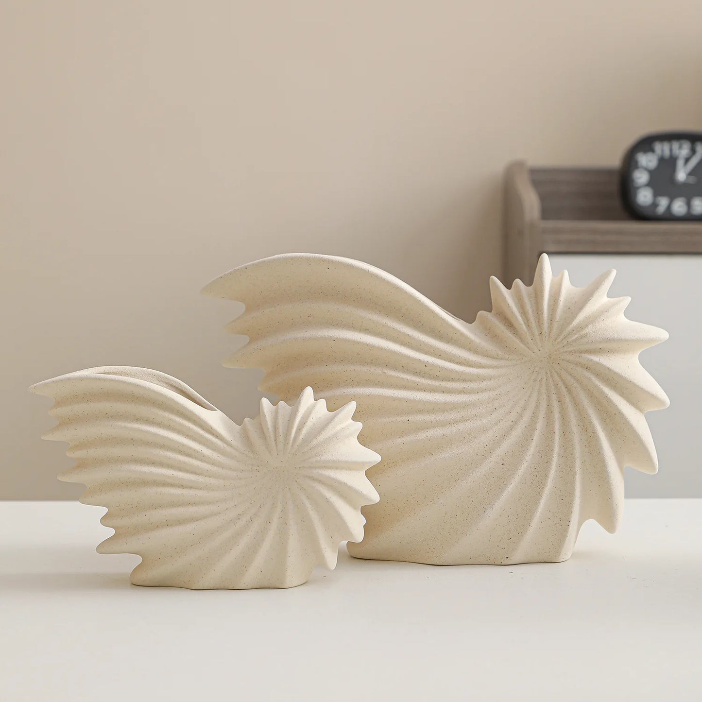 Nutshell ceramic conch design vase set in beige with textured spiral shell shapes for home decor