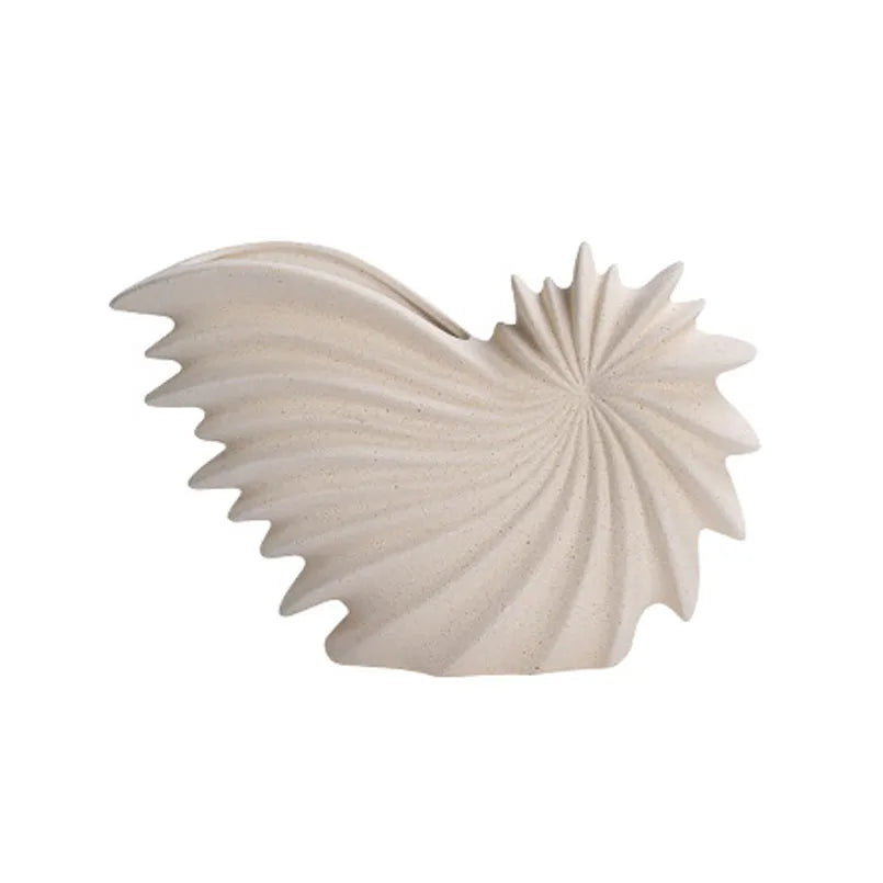 Nutshell ceramic conch design vase in beige with textured spiral shell shape