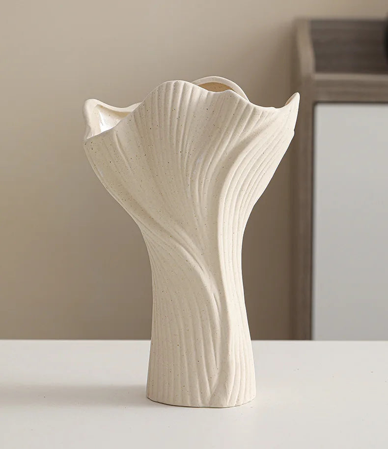 Nutshell ceramic conch design vase in matte white with textured ridges and organic shape