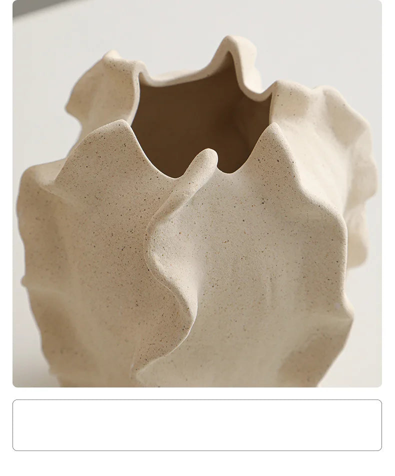 Nutshell ceramic conch design vase with textured beige finish and wavy edges
