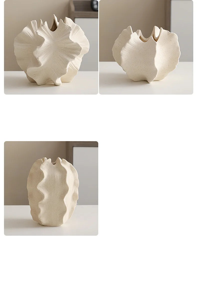 Nutshell ceramic conch design vase in neutral beige with textured organic shapes on white surface