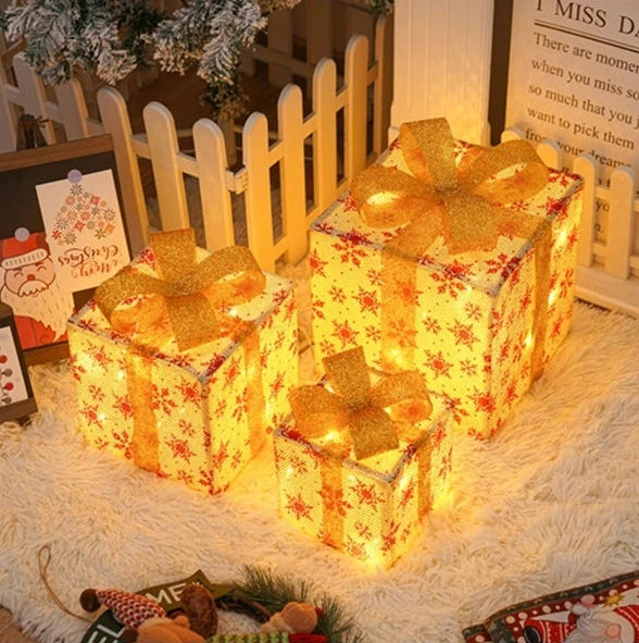 Festive Christmas light up gift boxes with bows, perfect for decorative holiday displays