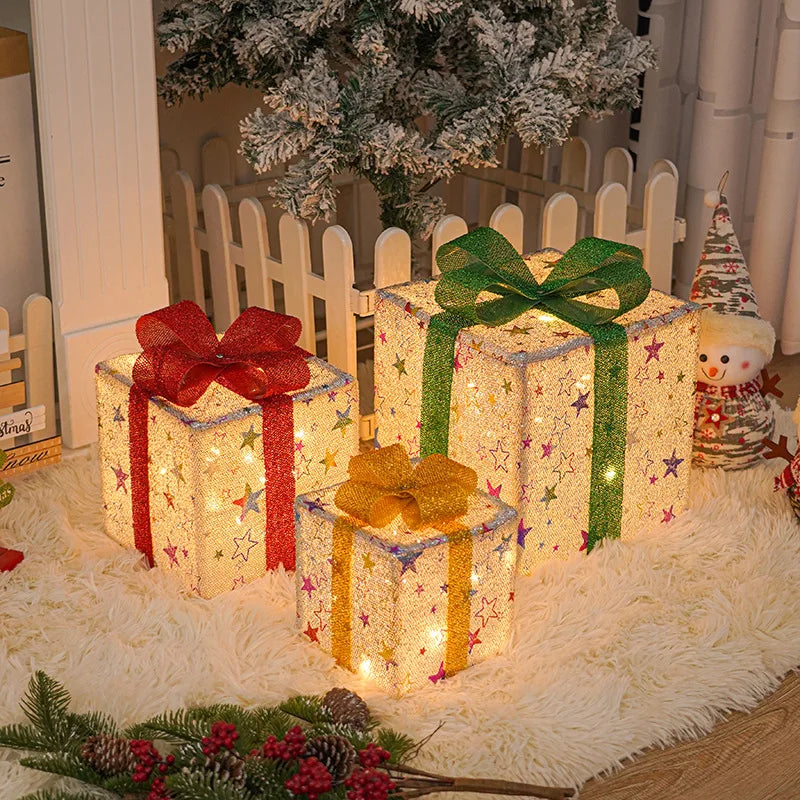 Decorative Christmas light up gift boxes in varying sizes with colorful bows for festive holiday decor