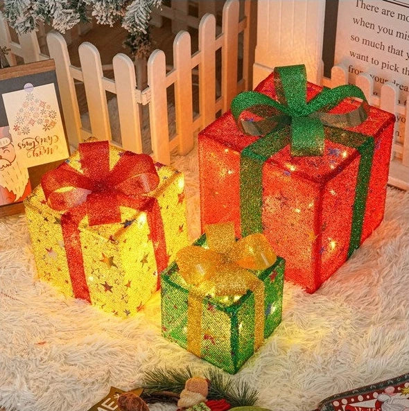 Colorful Christmas light up gift boxes with sparkling ribbons for festive holiday decor