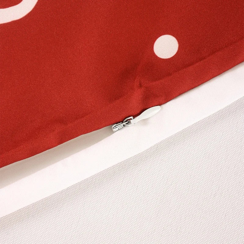 Close-up of a red Christmas Pillow Cover with a hidden zipper detail for festive home decor
