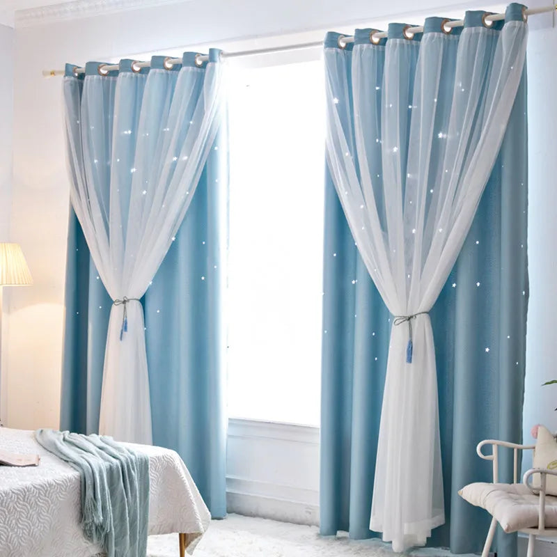 Nutshell Double Layer Sheer Star Curtains in blue with white sheer overlay and grommet top in bedroom