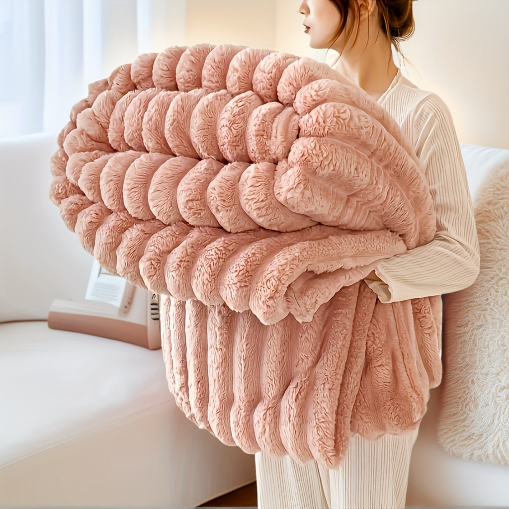 Nutshell luxury faux fur throw blanket blush pink plush oversized cozy throw held by woman on sofa