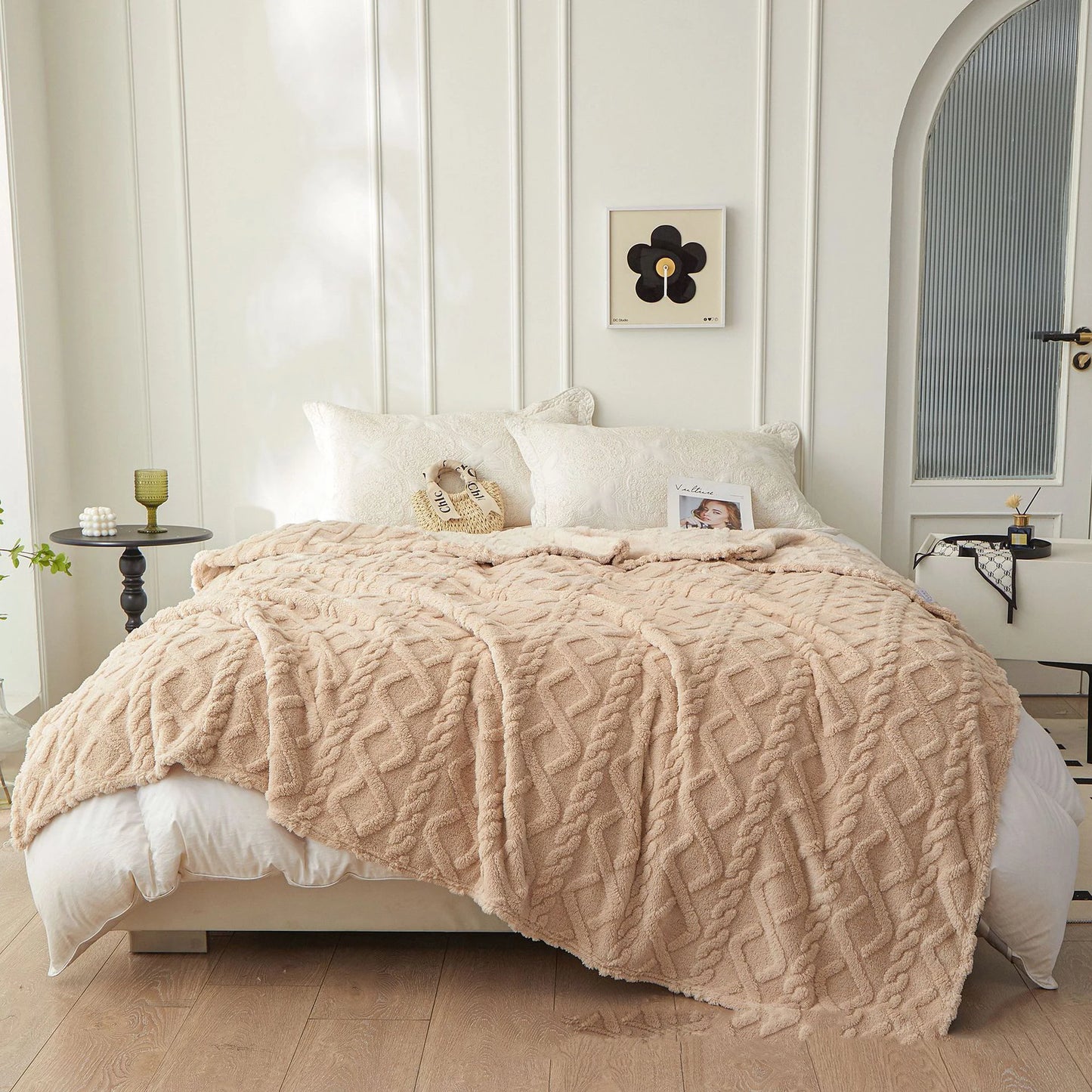Nutshell beige textured cozy bedspread shown as warm sofa throw blanket draped over bed with pillows