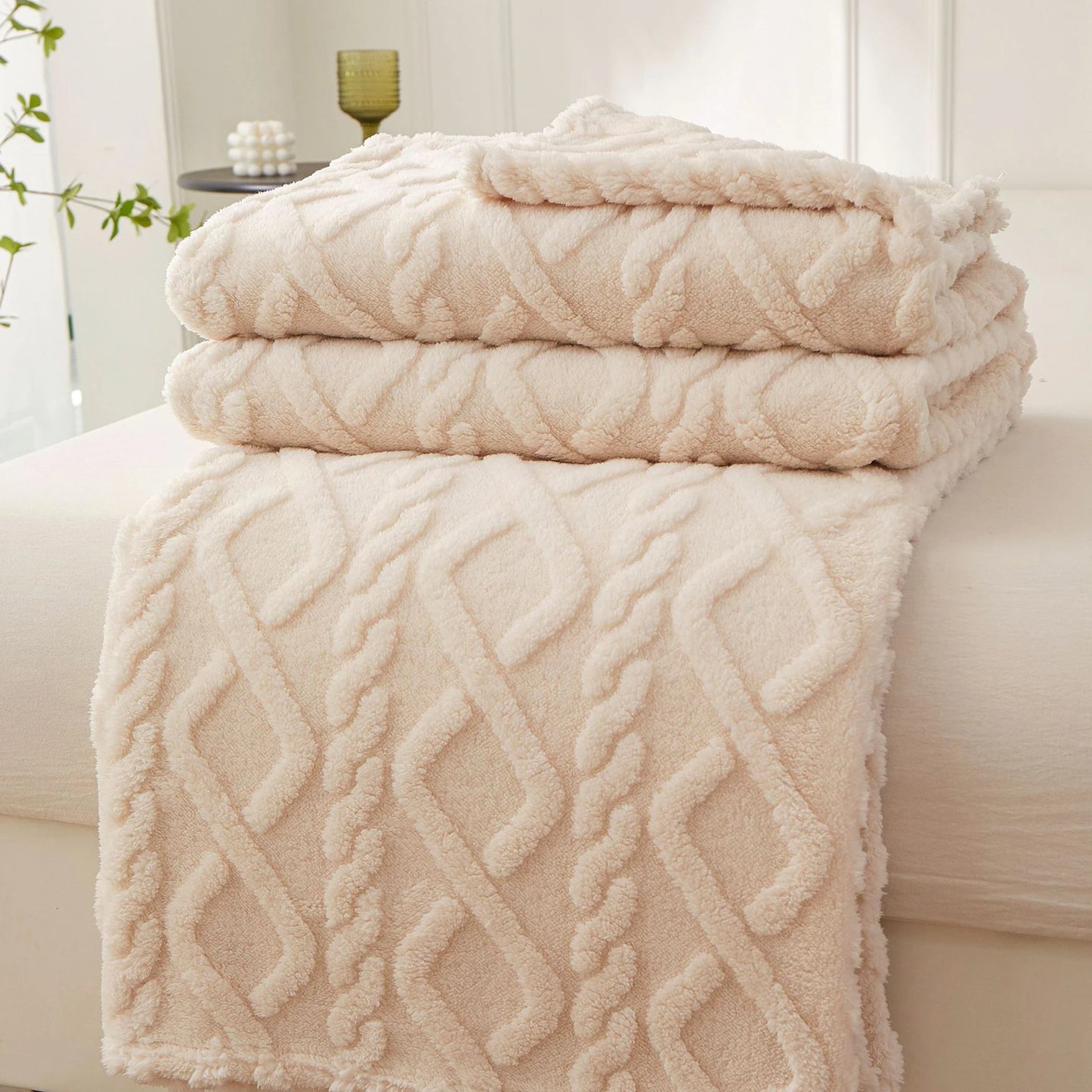 Nutshell plush cream cable knit warm sofa throw blanket folded on couch for cozy living room