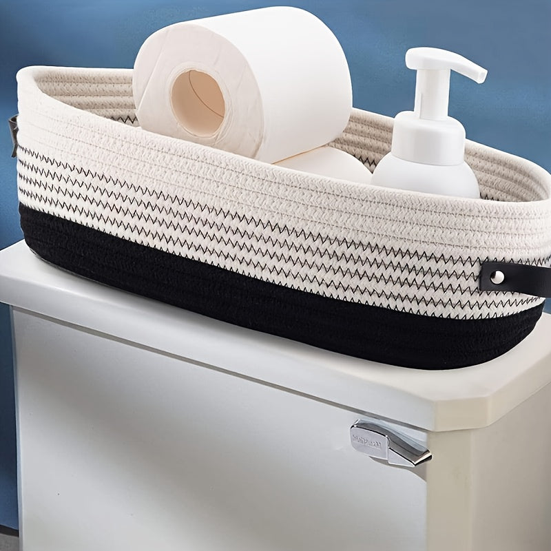Nutshell decorative storage basket in black and white, holding toiletries on a bathroom countertop