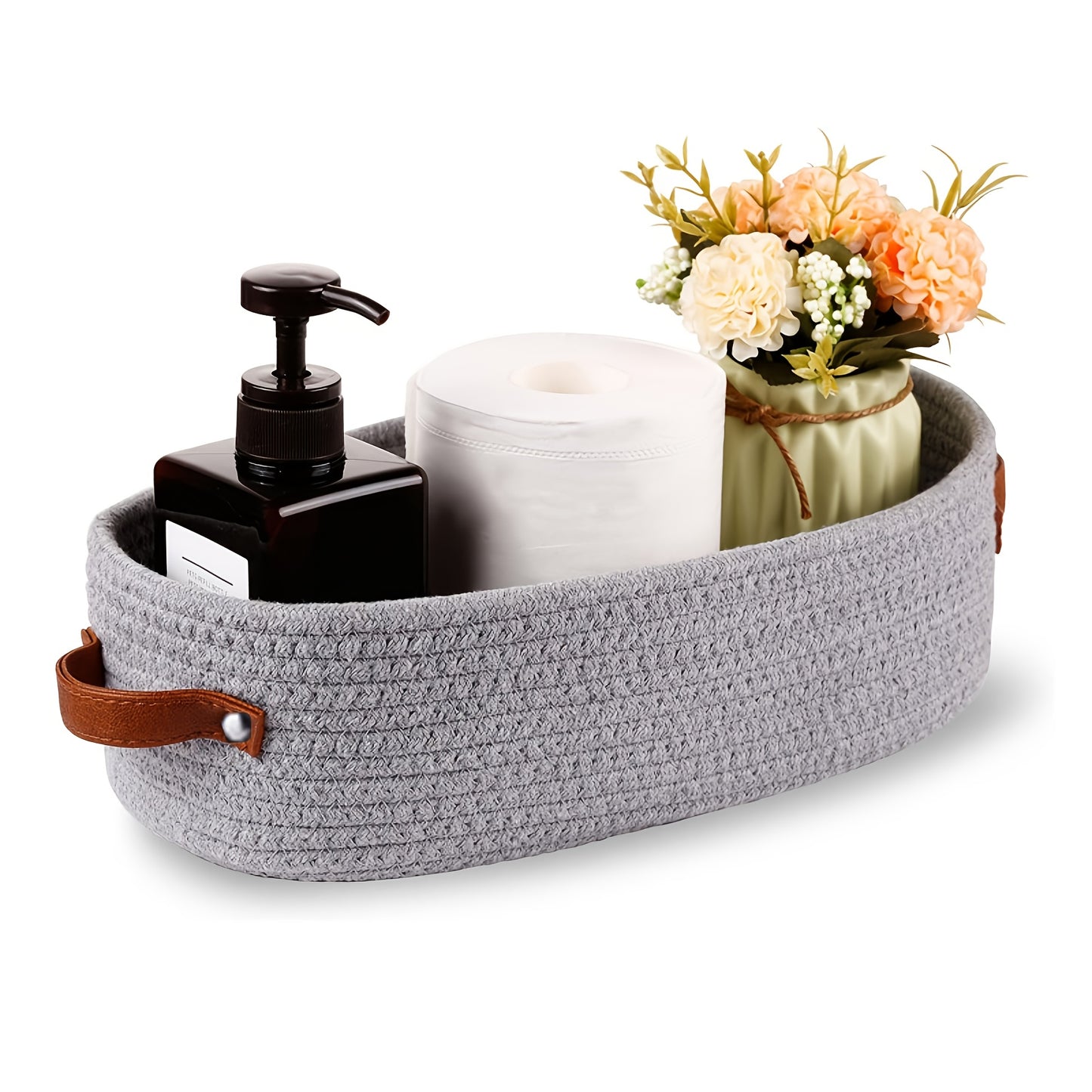 Nutshell decorative storage basket in gray with leather handles, styled with toiletries and flowers