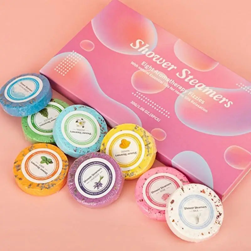 Nutshell essential oils shower steamers in assorted scents with colorful packaging and a pink box