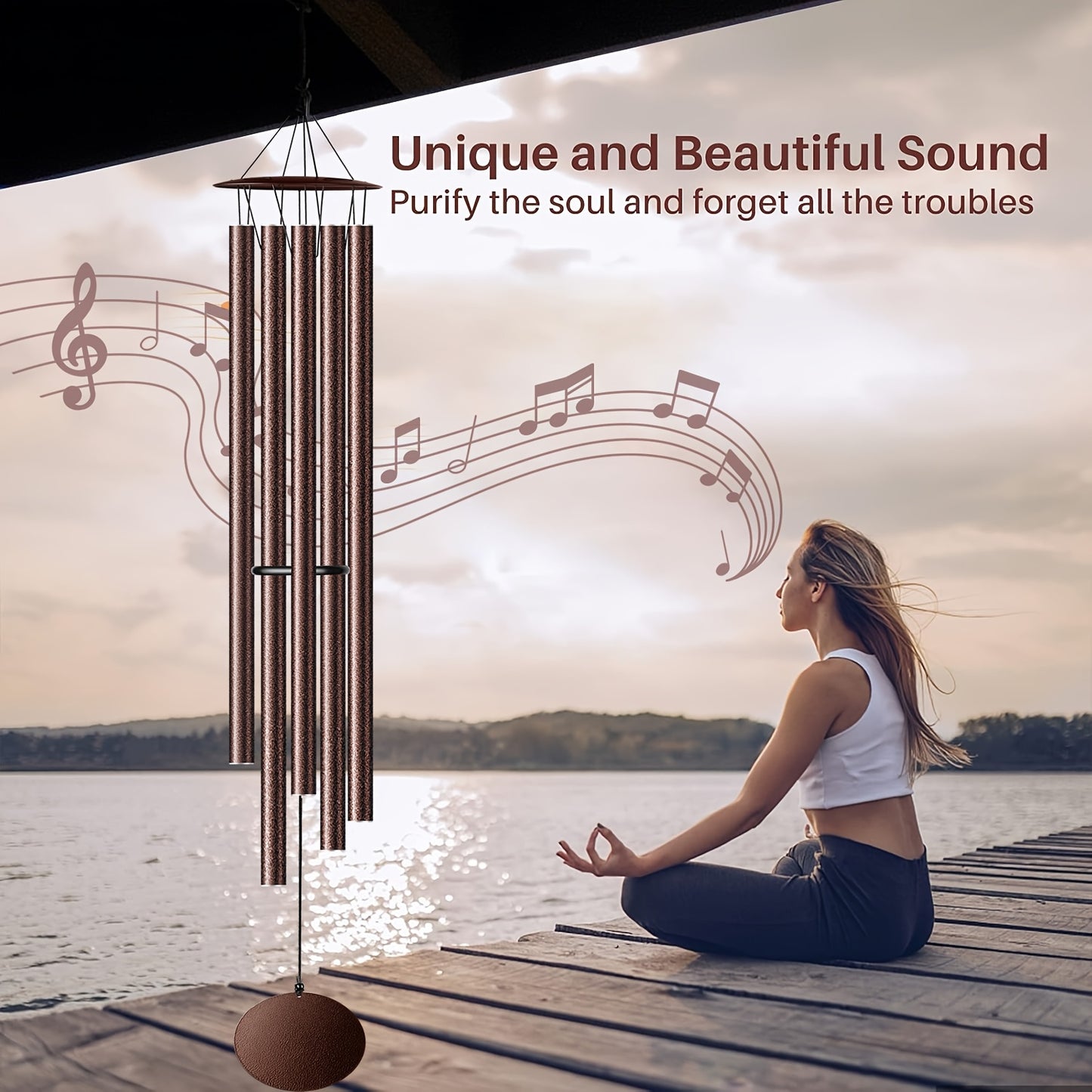 Extra large aluminium chimes outdoor creating a peaceful sound by the lake with a person meditating