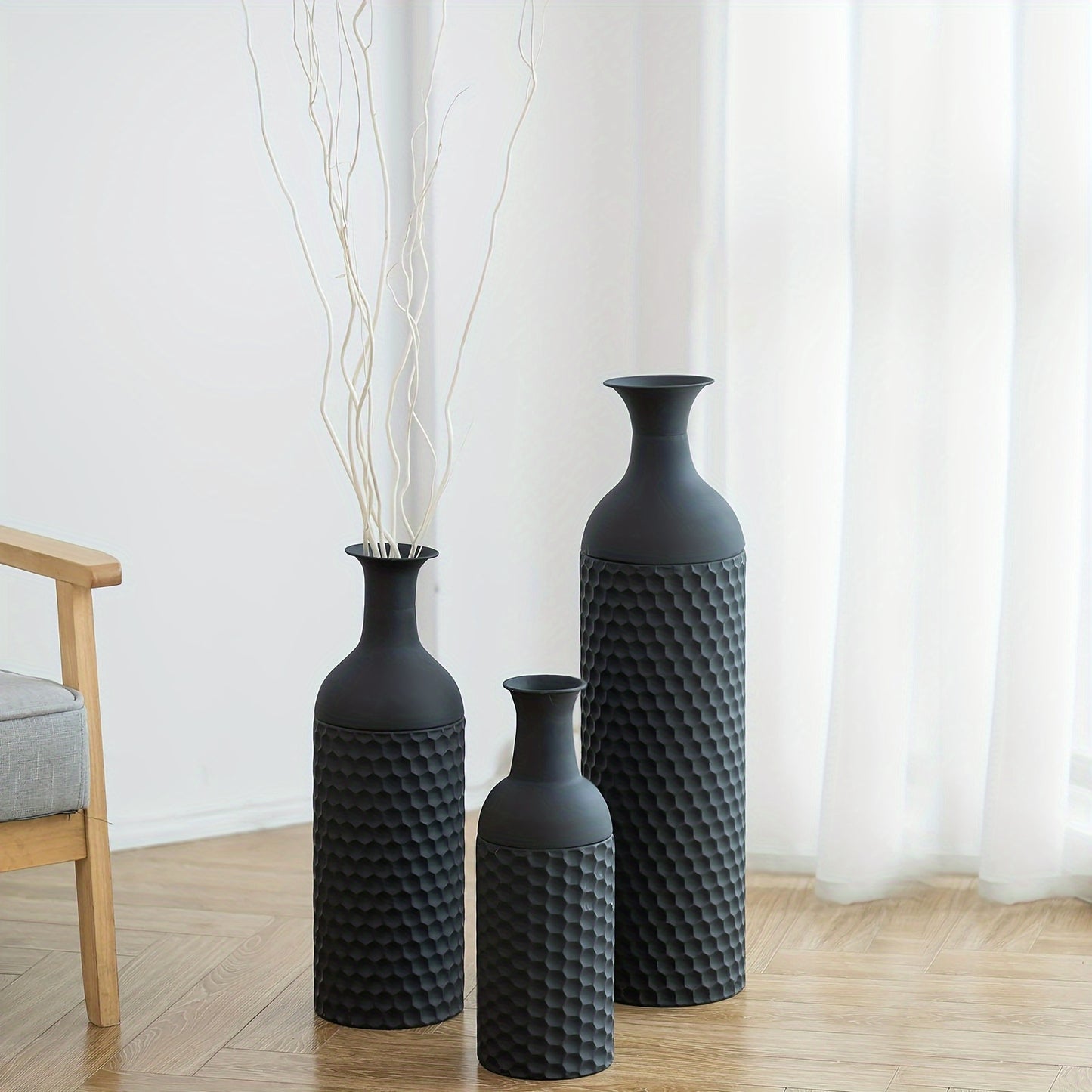 Set of three textured black extra large metal floor vases for modern home decor