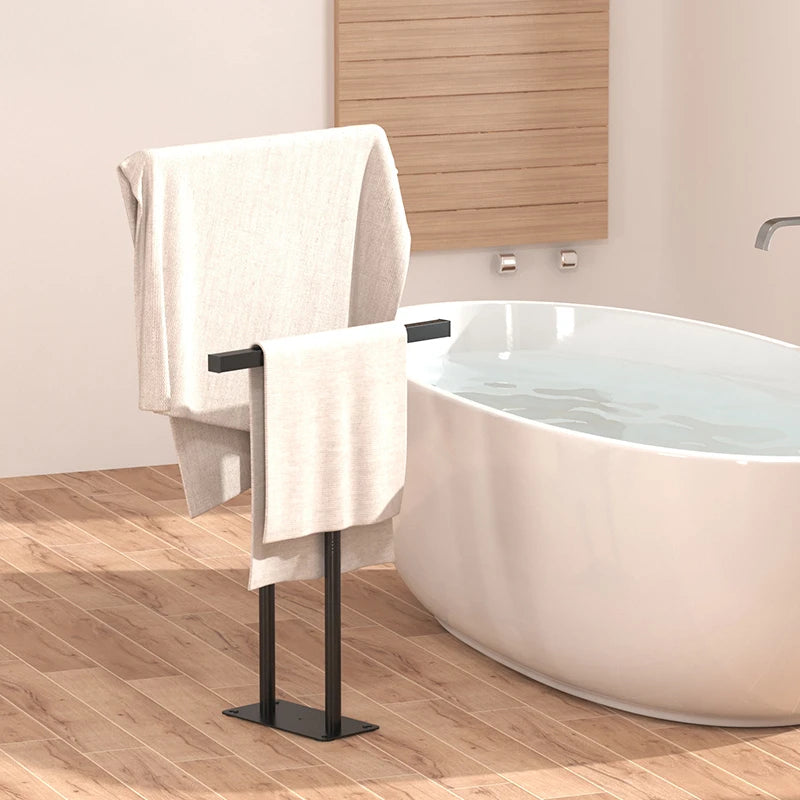 Modern floor standing towel rack with shelf featuring a sleek design for bathroom organization