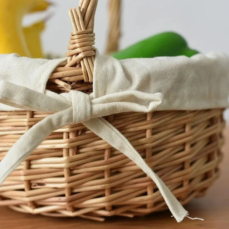 Nutshell handcrafted wicker basket with fabric lining and tied bow on wooden table