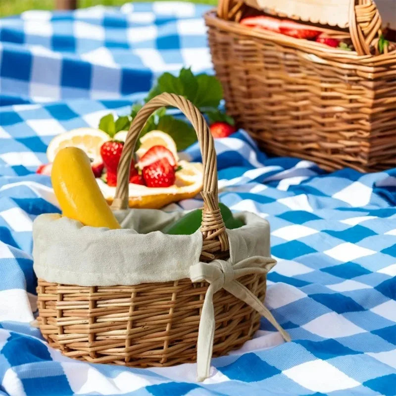 Handcrafted wicker basket by Nutshell on blue checkered picnic blanket holding bananas and avocado