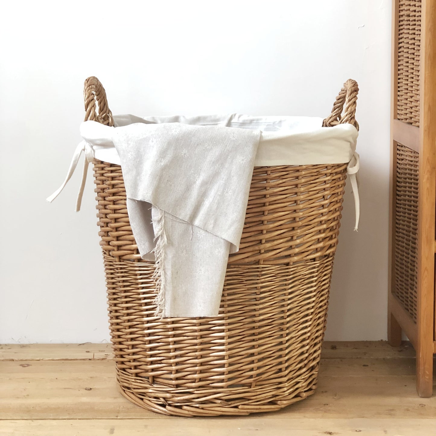 Handmade Woven Basket with a Fabric Insert, perfect for organizing and home decor.