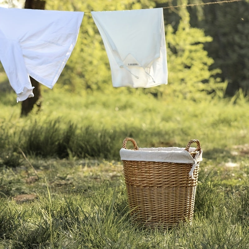Handmade Woven Basket with a Fabric Insert placed outdoors with laundry hanging nearby