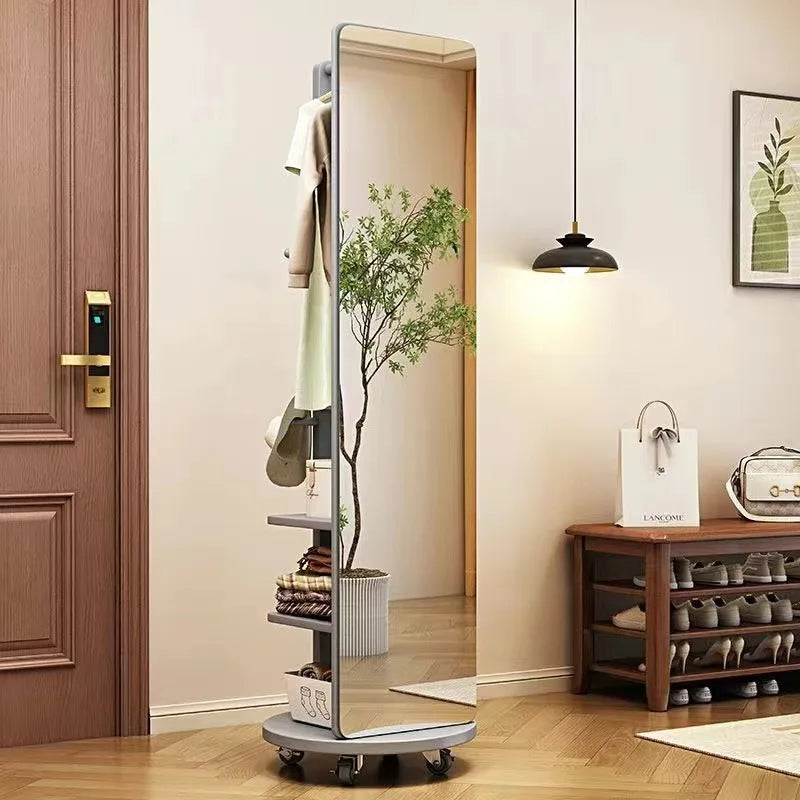 Rotating Full Length Mirror by Nutshell freestanding with shelves hooks caster wheels in entryway