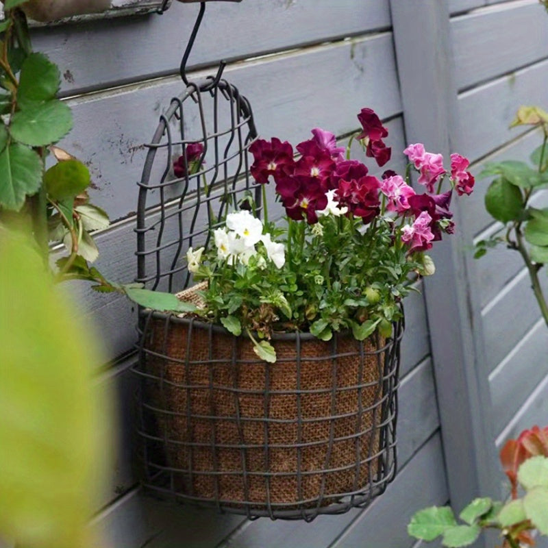 Nutshell iron wire wall basket with vibrant flowers, perfect for indoor or outdoor decoration