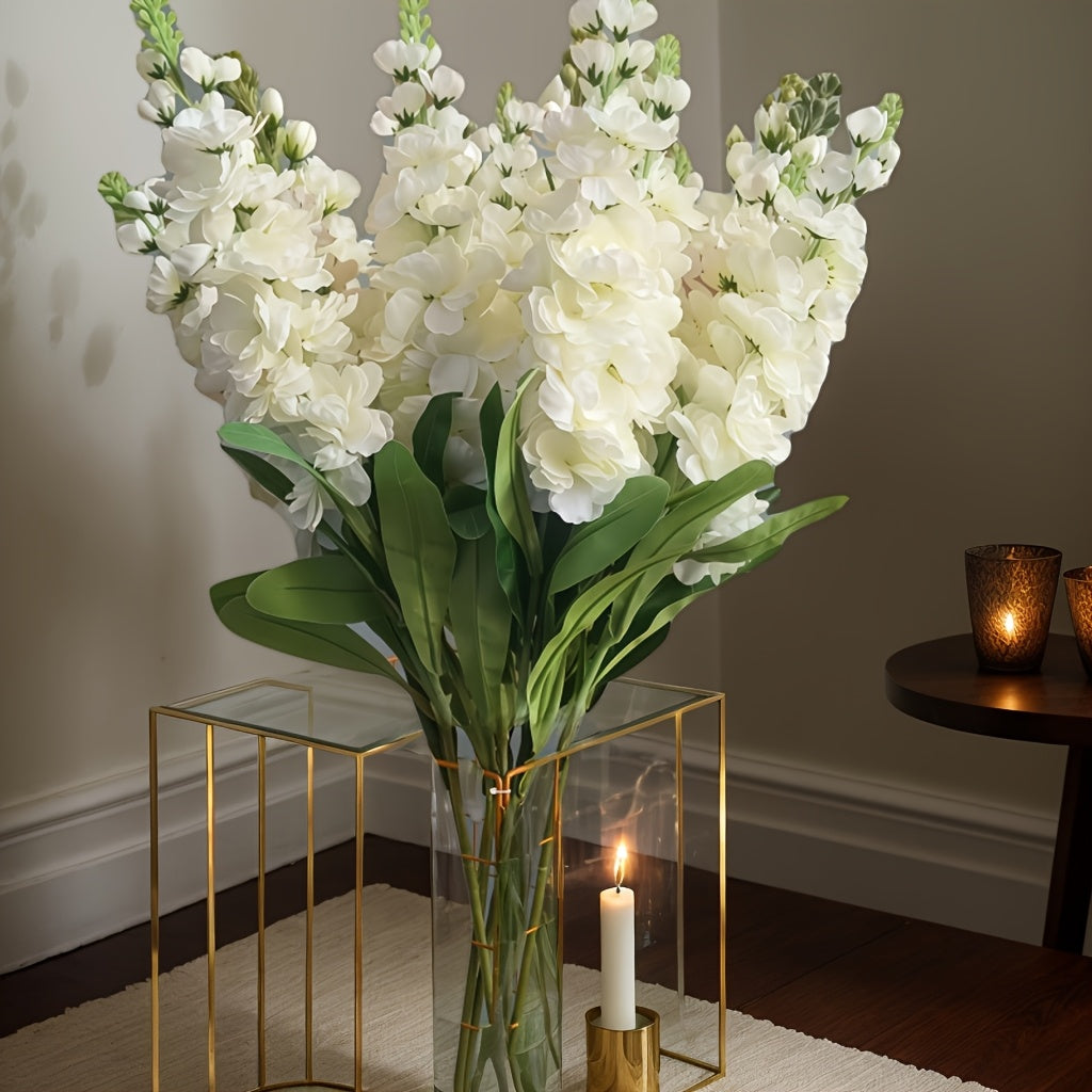 Large outdoor artificial delphinium in a clear vase with lush green leaves, perfect for elegant decor