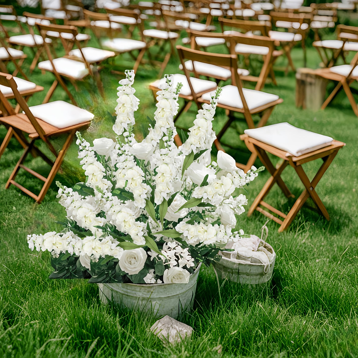 Large outdoor artificial delphinium arrangement in a rustic pot, perfect for event decoration