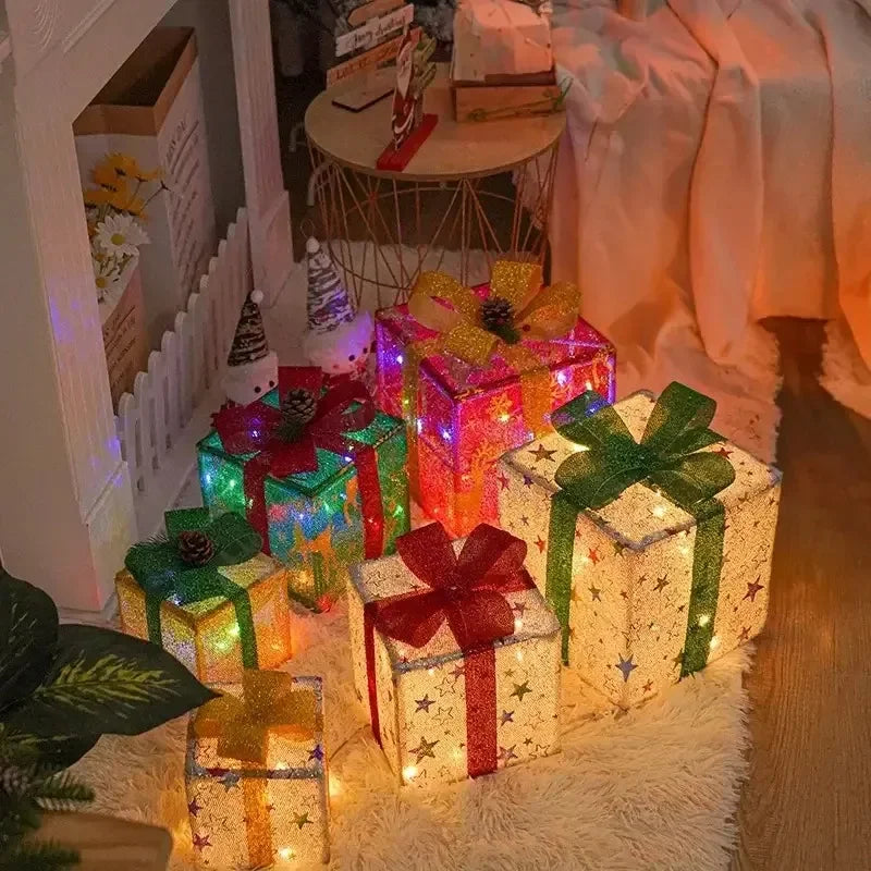 Colorful lighted Christmas gift box set with stars and bows, perfect for festive holiday decor
