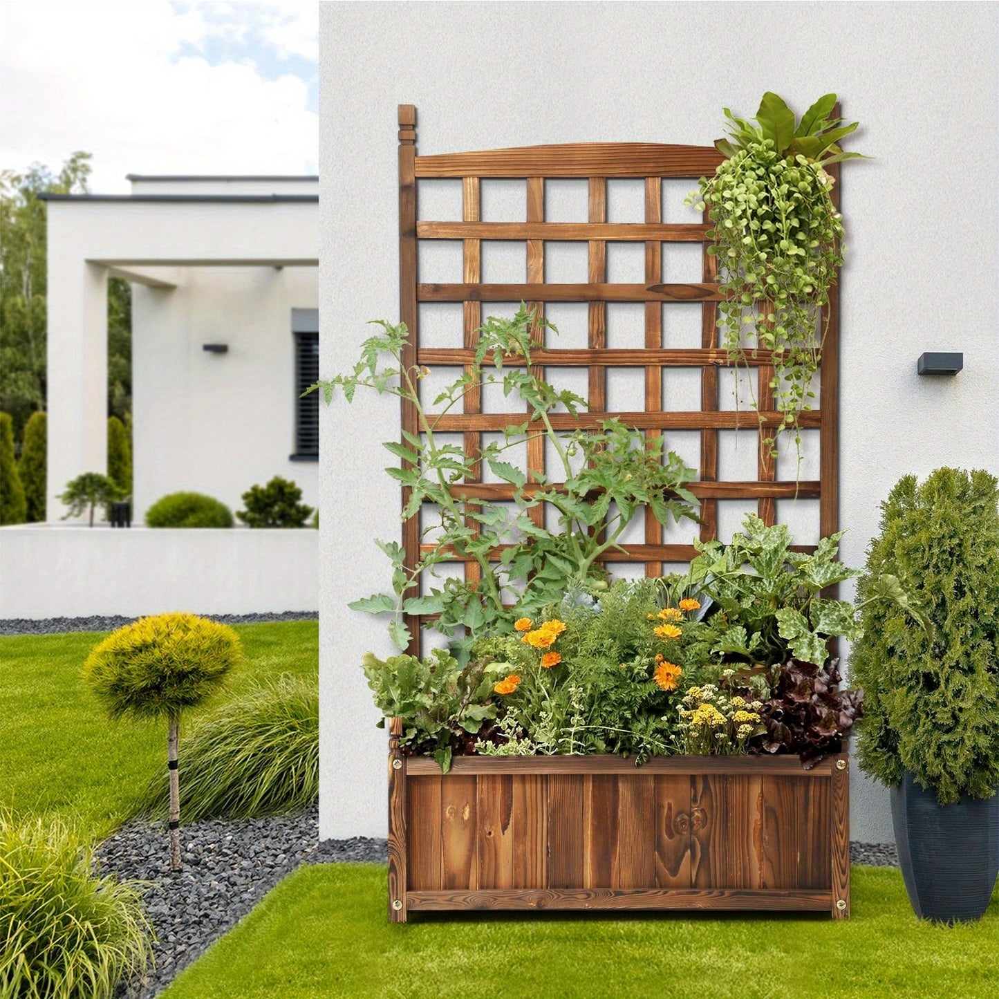 Nutshell Raised Wooden Garden Bed with Trellis, filled with colorful flowers and vegetables in a landscaped yard