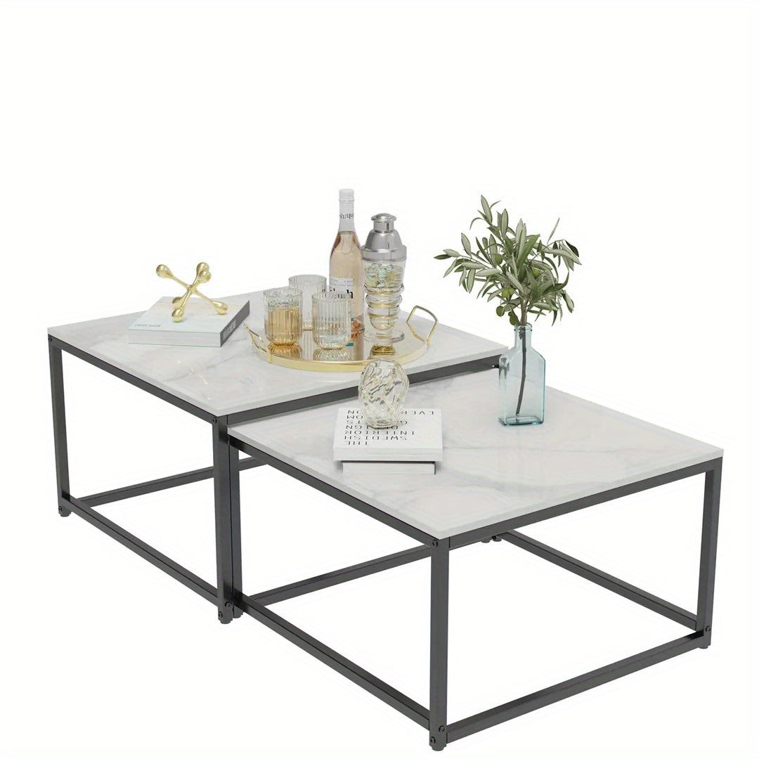 Nutshell Rectangle Nesting Coffee Table Set with black metal frame and white marble tops styled with drinks and decor