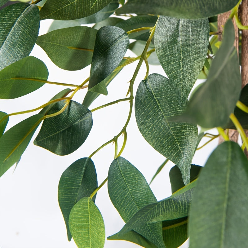 Close-up of leaves on a luxury faux Ficus bonsai tree showcasing realistic texture and vibrant green color