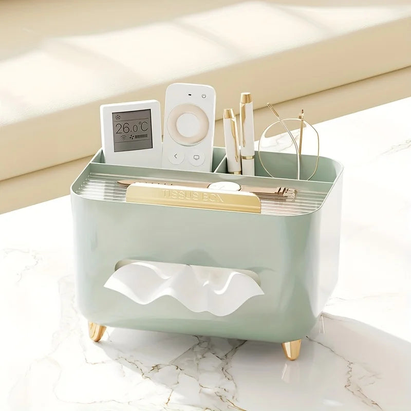 Nutshell multifunctional desk organizer with tissue box holding remote controls pens and glasses on a marble surface