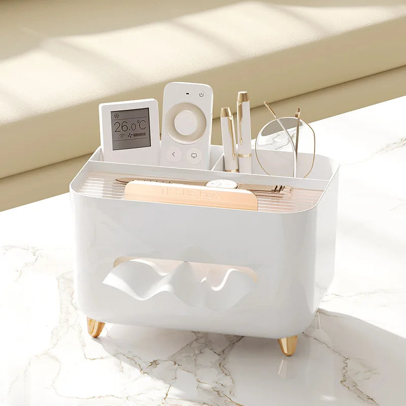 Nutshell multifunctional desk organizer with tissue box holding remote, pens, glasses, and thermometer on white surface