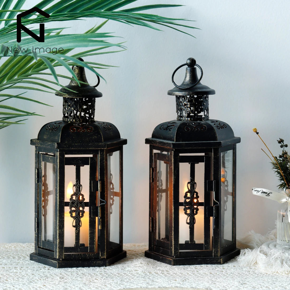 Nutshell vintage candle holder lanterns with black metal frame and decorative cross design