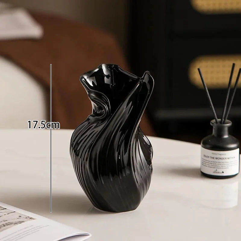 Nutshell Nordic abstract ceramic vase in black with unique twisted design, 17.5 cm tall