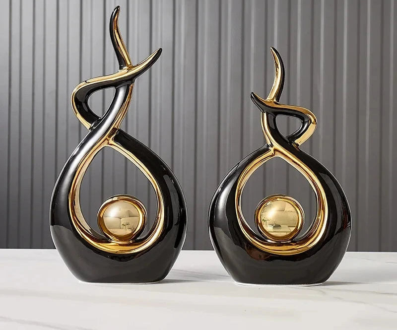Nutshell black and gold vases shaped as abstract Nordic home decor figurines for modern interiors