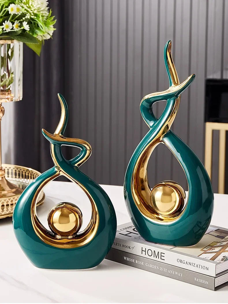Nutshell vases with green and gold finish shaped as Nordic home decor figurines on a table