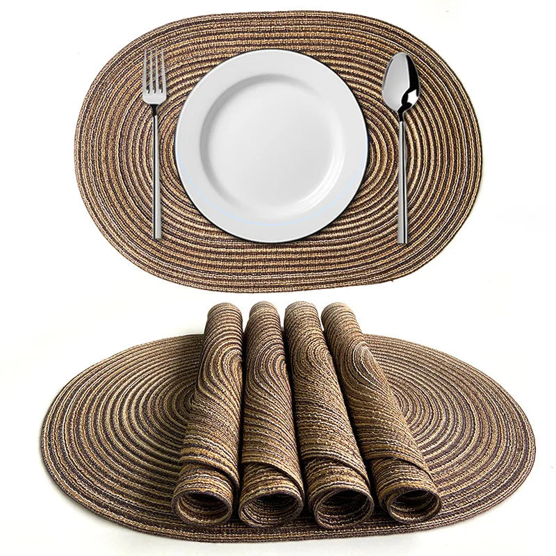 Set of Nutshell Oval Braided Placemats in Natural Color with Silver Cutlery and White Plates
