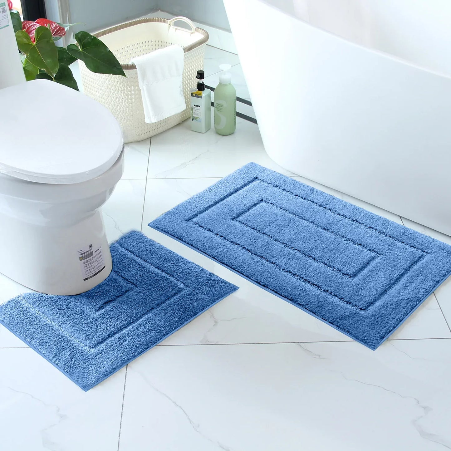Nutshell plush bathroom floor mat set in blue, perfect for adding comfort and style to your bathroom