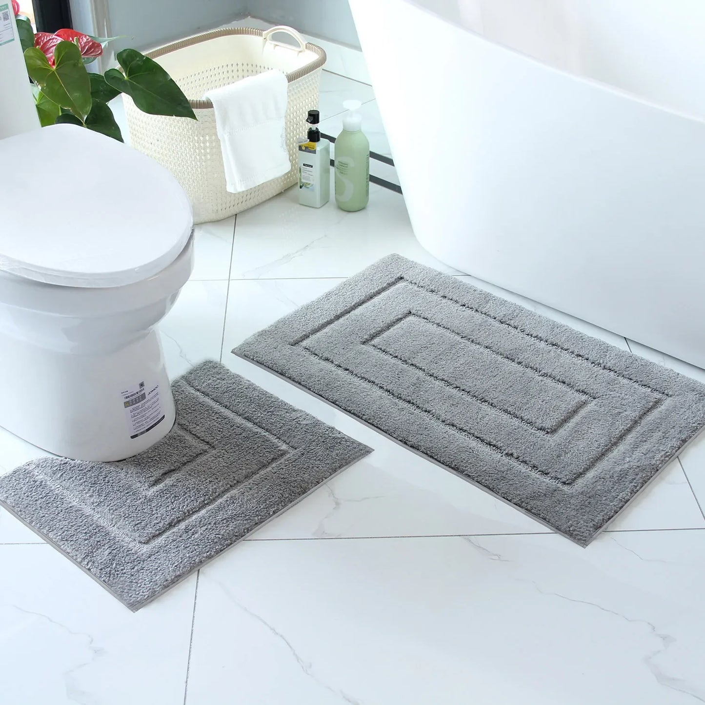 Soft gray plush bathroom floor mat set with contoured shapes for enhanced comfort and style