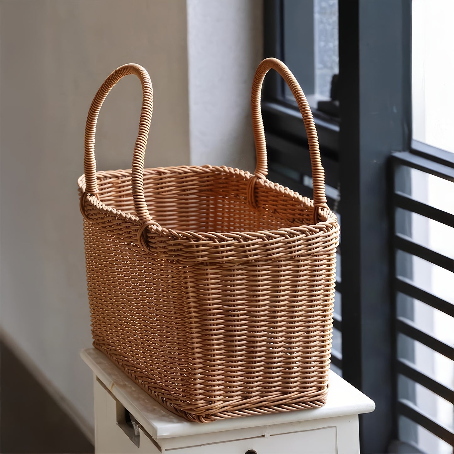 Nutshell rattan picnic basket with sturdy handles, perfect for outdoor meals and gatherings