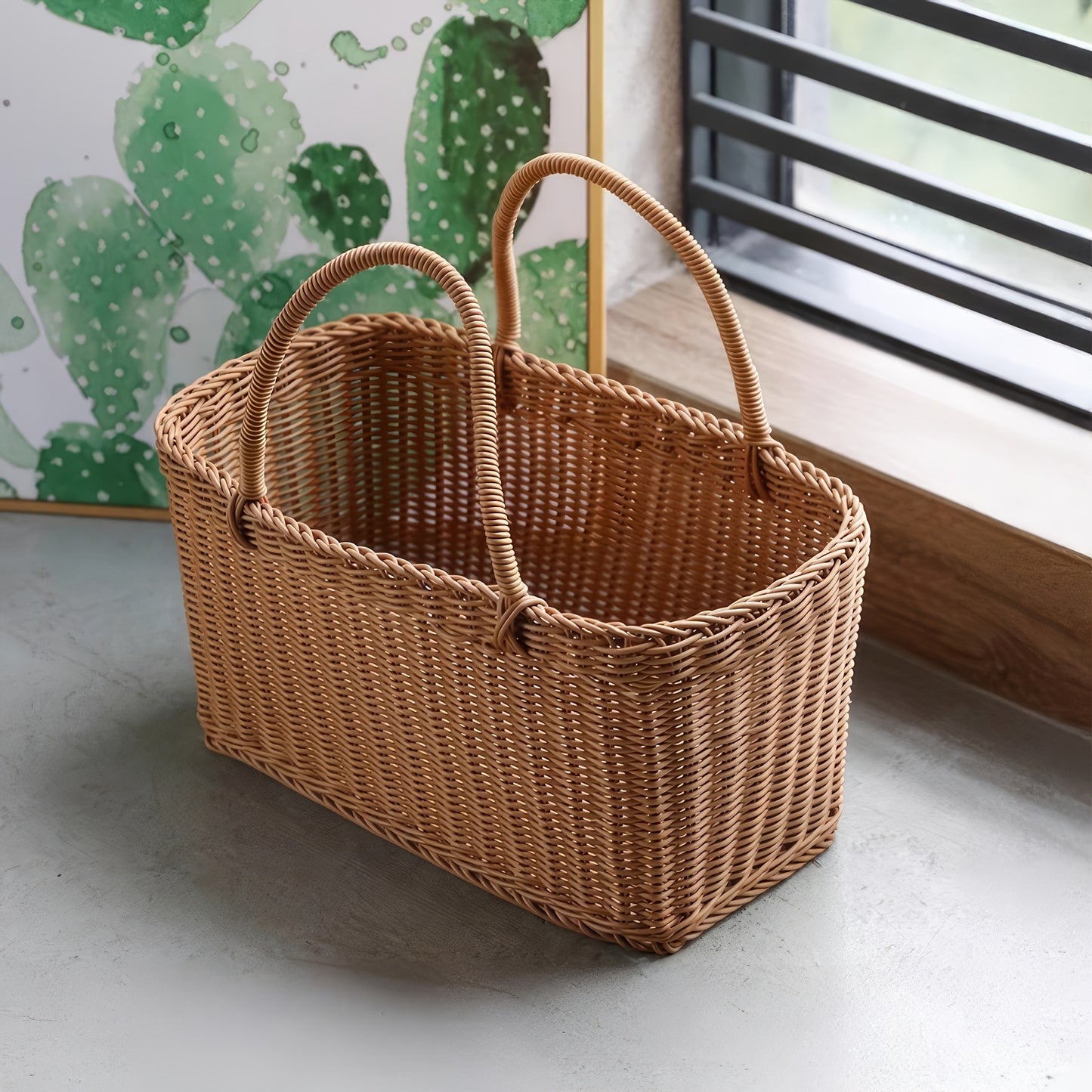 Nutshell rattan picnic basket with two sturdy handles for outdoor events and gatherings
